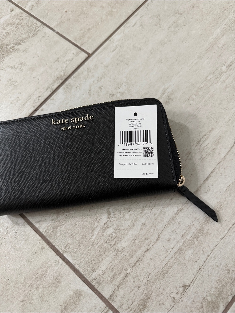 kate spade black zip-around Saffiano wallet with gold logo..nwt ..authentic